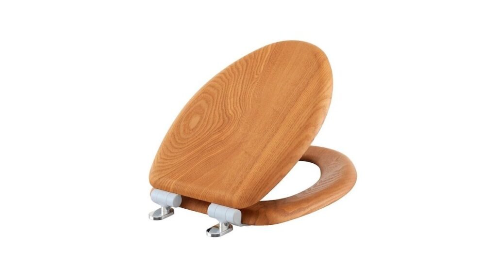 A polished oak wood toilet seat installed in a clean, modern bathroom setting.
