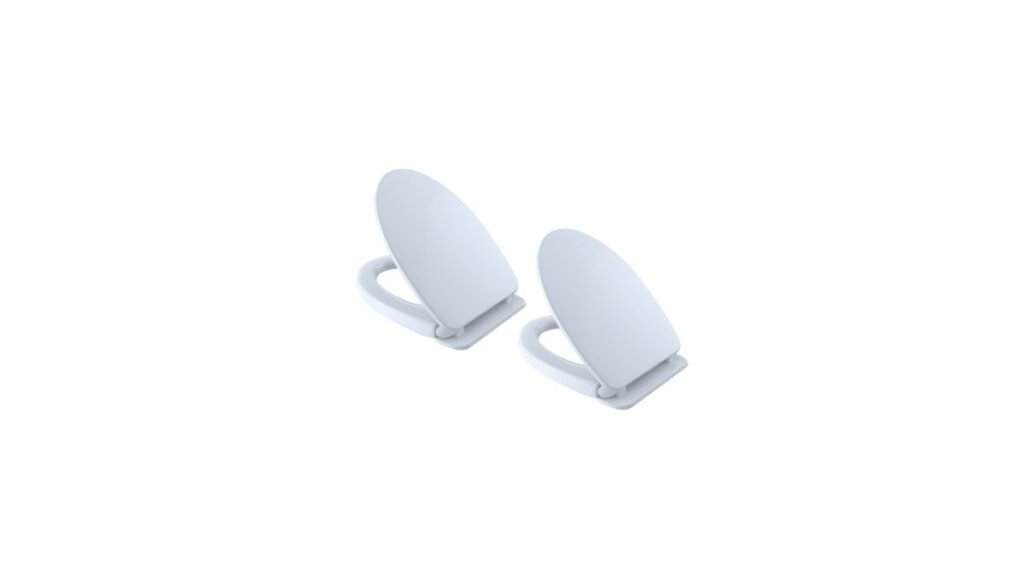 A modern Toto toilet with a slow-close seat in a bright bathroom.