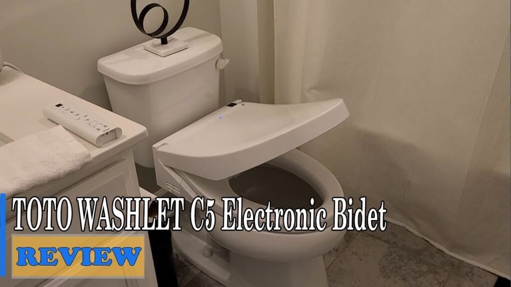 A modern Toto Washlet C5 electronic bidet seat inside a clean minimalist bathroom.