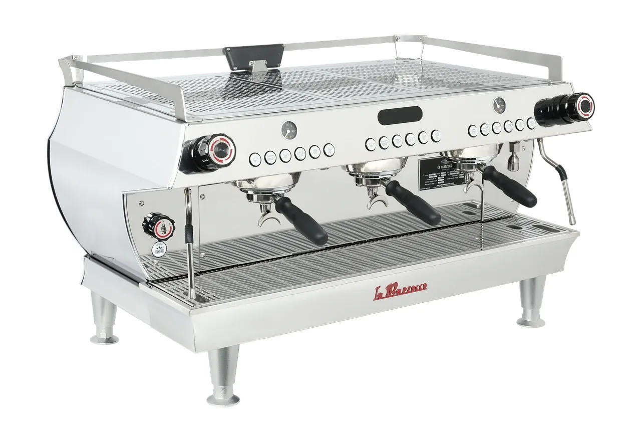 Two different espresso machines side by side on a wooden kitchen counter.