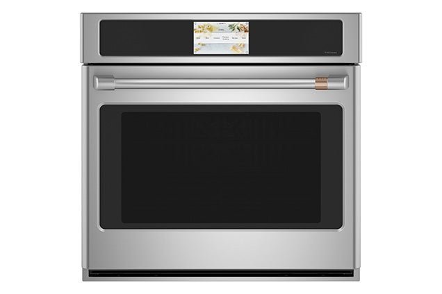 A bubble level placed inside a wall oven to ensure the rack is flat.