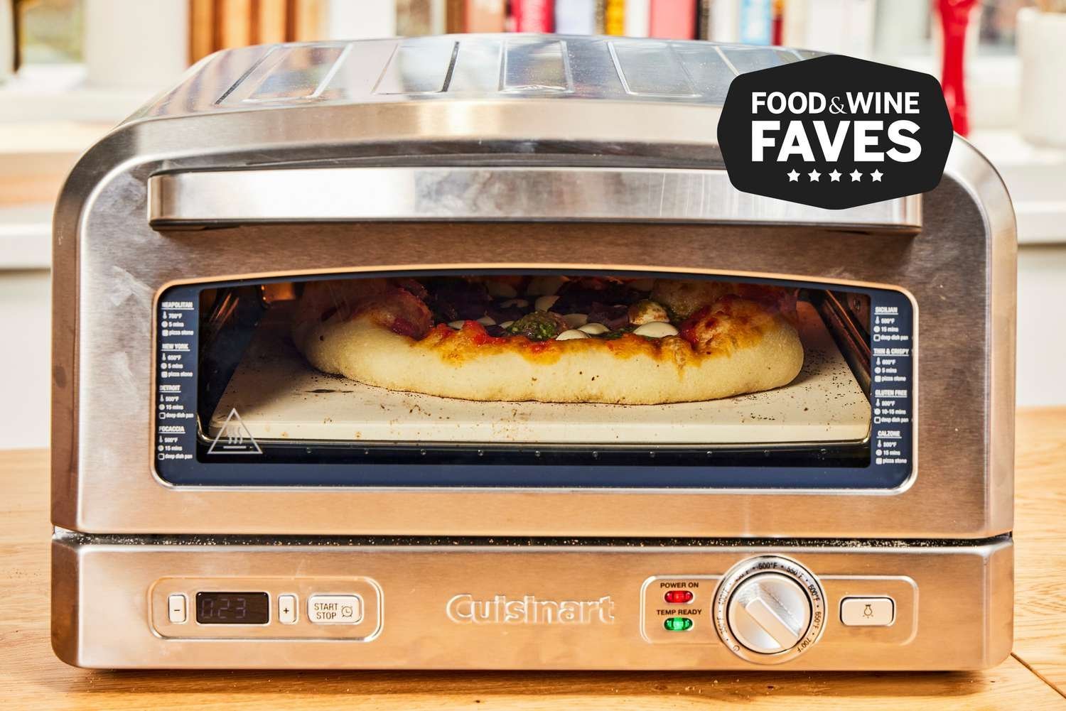 Two different types of pizza ovens suitable for indoor and outdoor cooking setups.