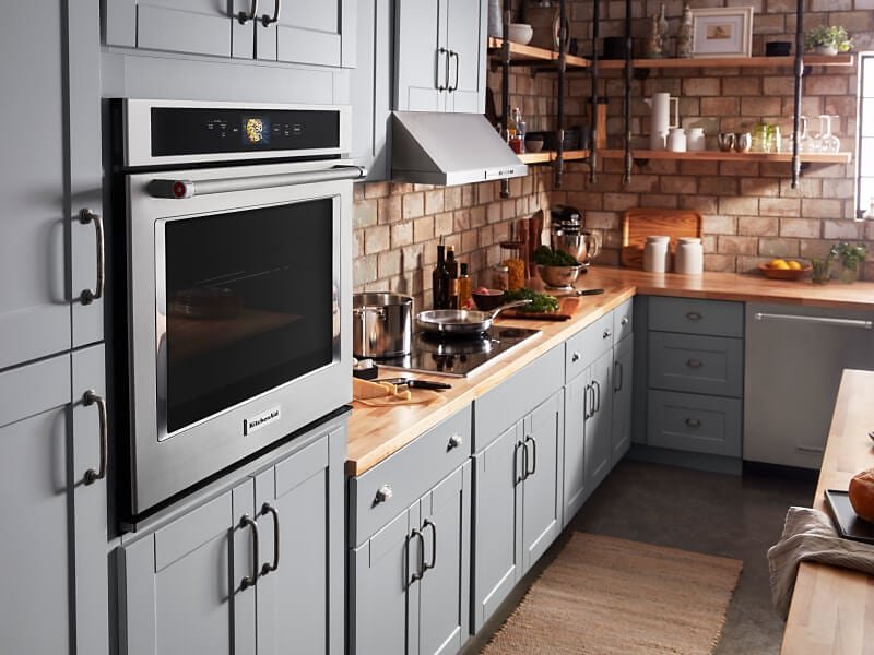 A slim compact oven fits perfectly into a tight space in a small kitchen.