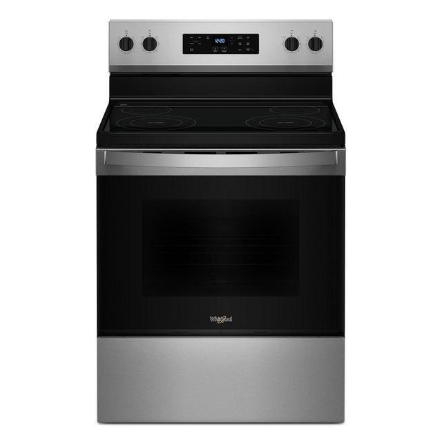 Stubborn burnt-on grease stains inside a stainless steel oven after heavy roasting usage.