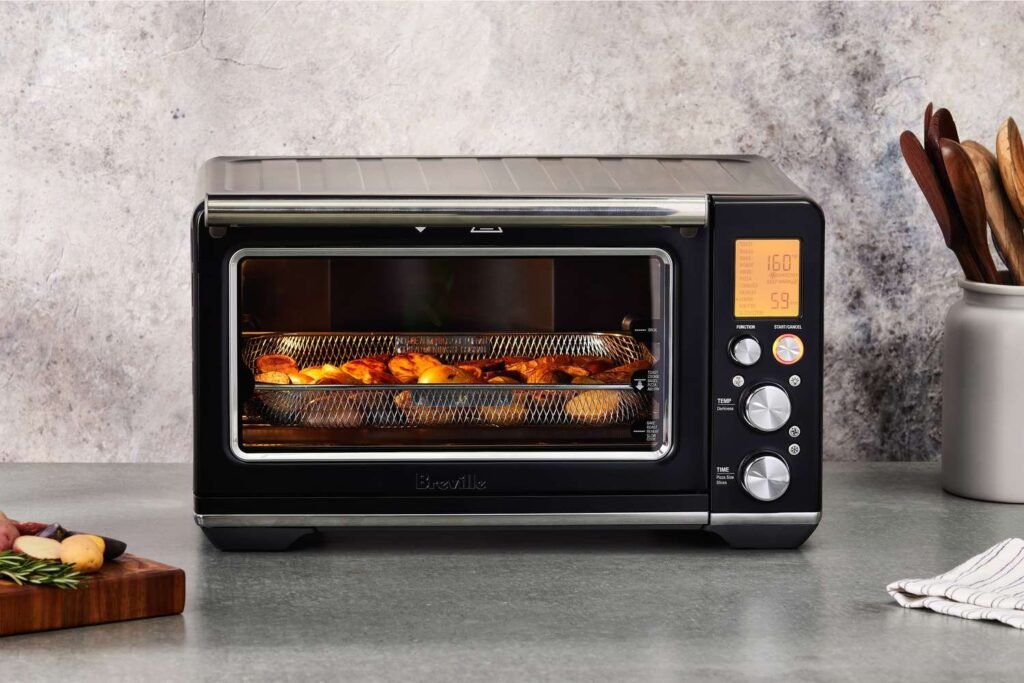 A modern kitchen interior showing an integrated stainless steel oven for versatile cooking.