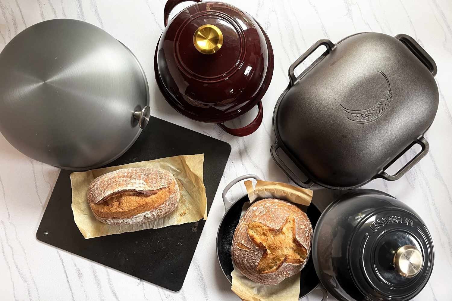 A workspace with baking guides and measuring tools for answering oven questions.
