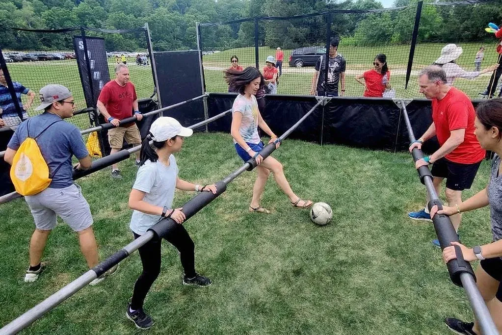 Adjusting human foosball pole screw to fix friction issues on field