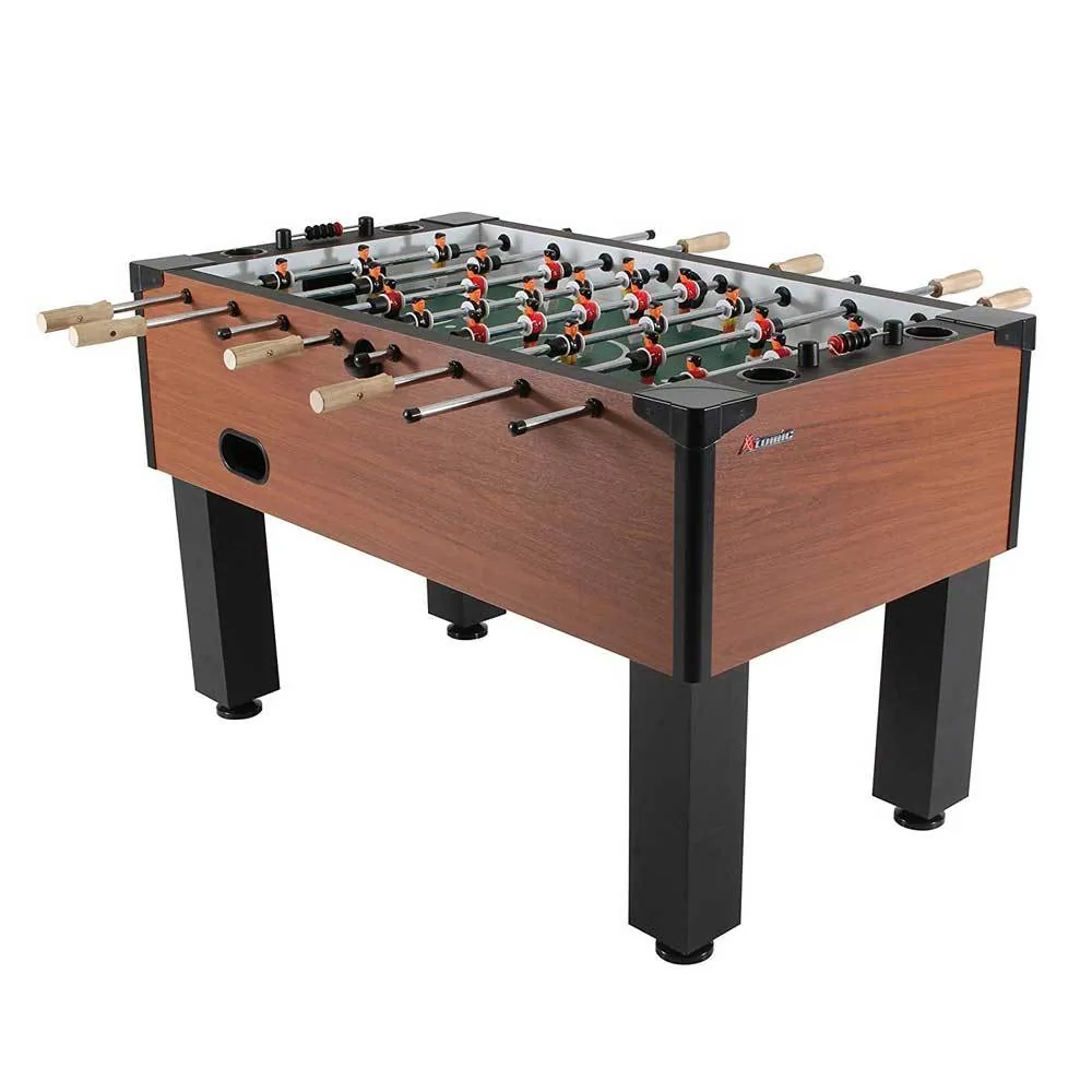 Adjusting settings on a compact foosball table in a small living space