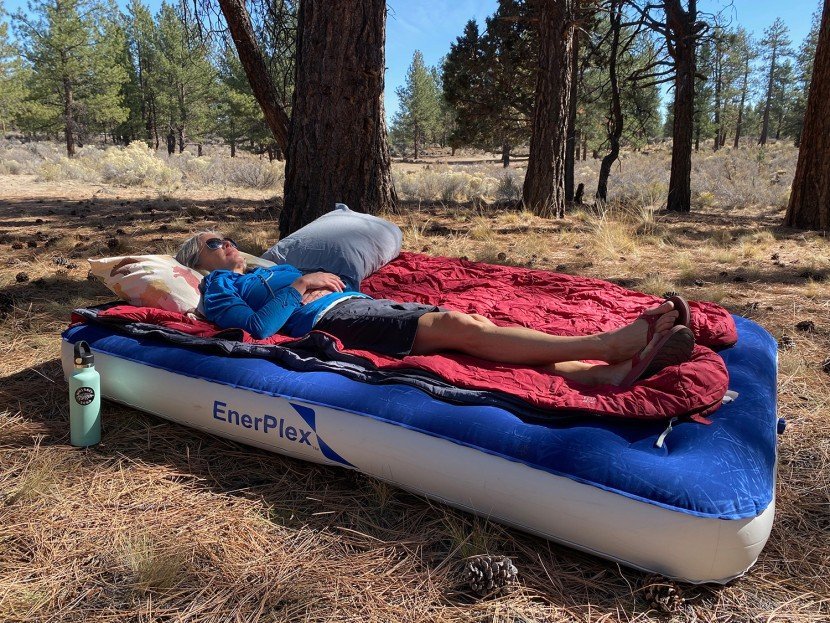 air mattress pump on a white table with camping gear in a modern store