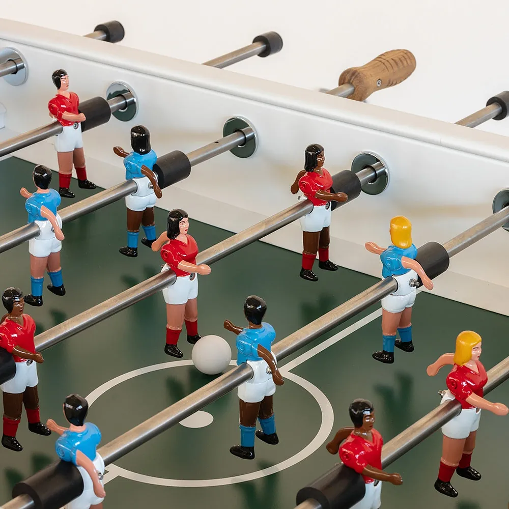 Applying silicone lubricant to a foosball rod for maintenance.