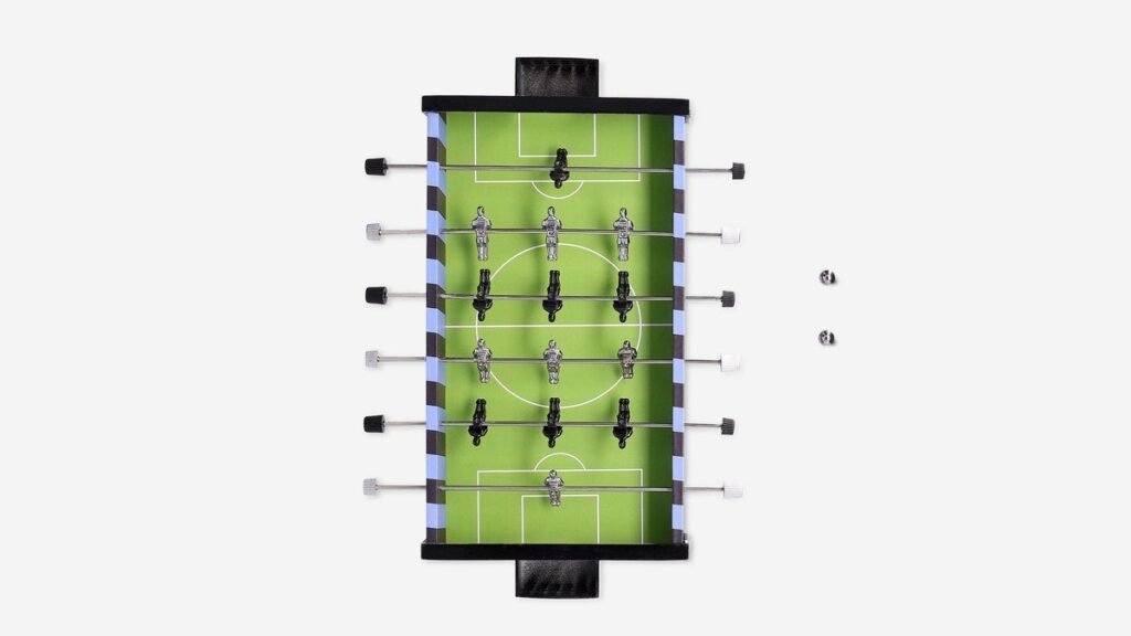 Assembled foosball table setup in a bright modern living room