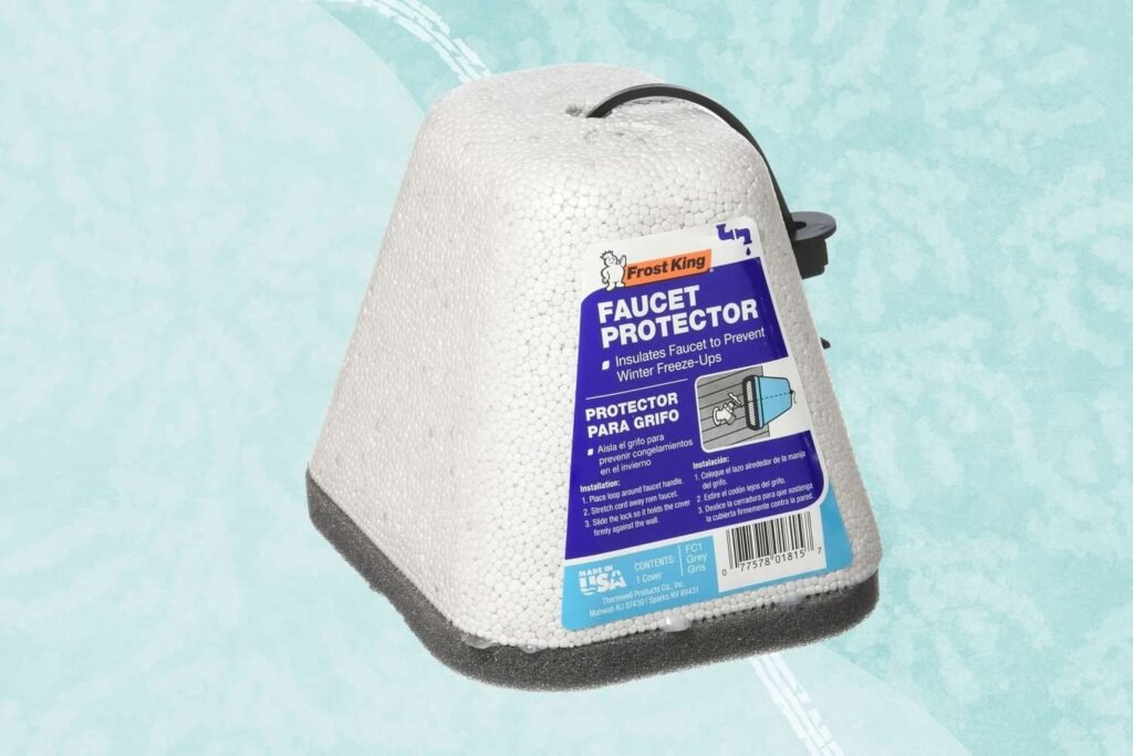 An assortment of outdoor faucet covers sits ready for winter protection against the house.
