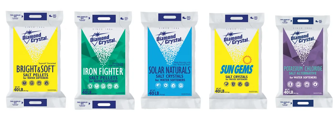 A bag of potassium chloride salt sitting on a clean laundry room floor.