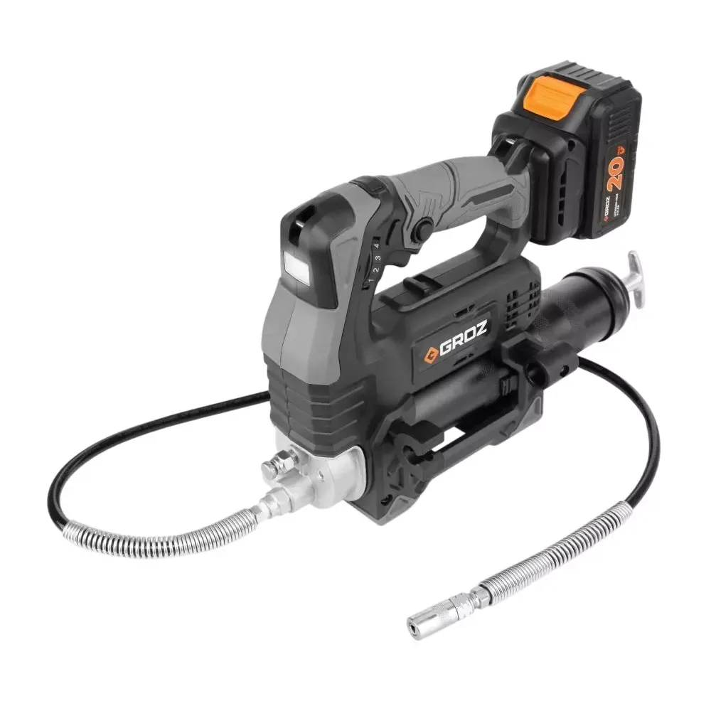 Bare cordless grease gun with battery and charger on a workbench.