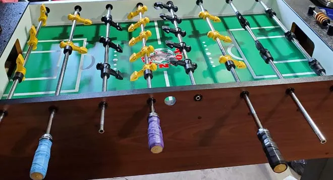 Broken plastic gear teeth and a bent rod showing common foosball mistakes