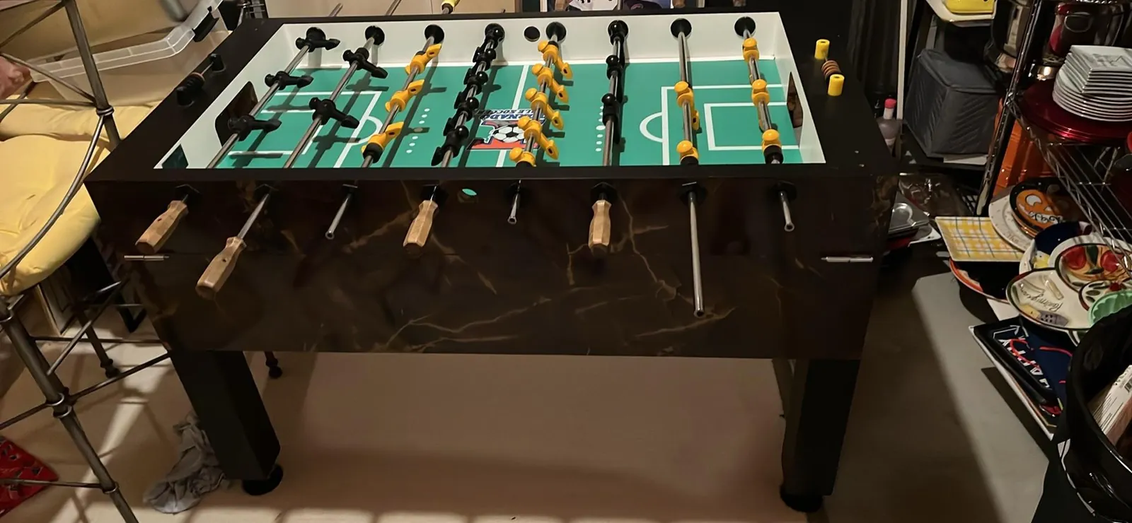 Cheap plastic foosball table on hardwood floor