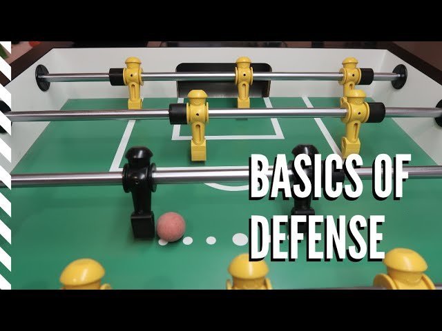 Close-up of foosball table defensive players ready to block shots