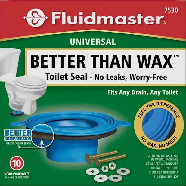 A close-up showing a toilet flange correctly positioned on a finished bathroom floor.