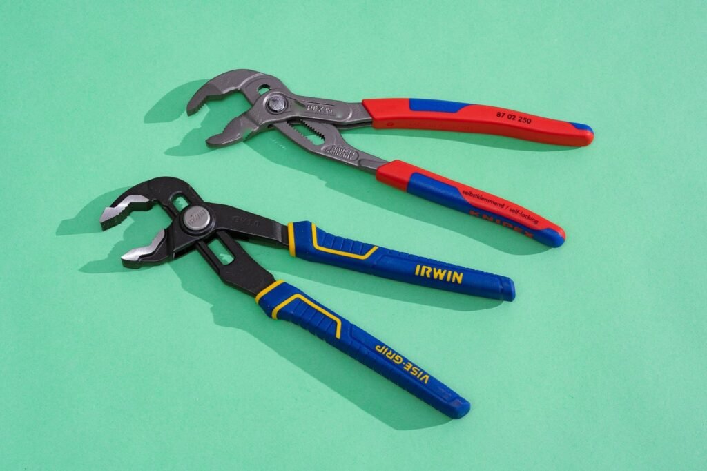 A collection of high-quality tongue and groove pliers displayed on a workbench.