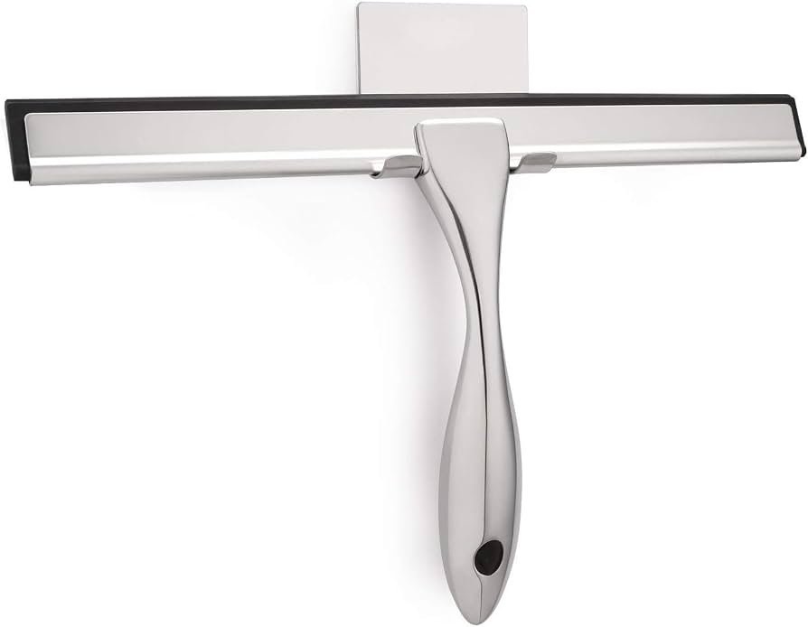 A collection of various shower squeegees neatly arranged on a modern bathroom vanity.