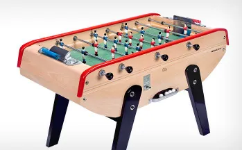 A colorful Bonzini Sport foosball table ready for family fun in a cheerful living space.