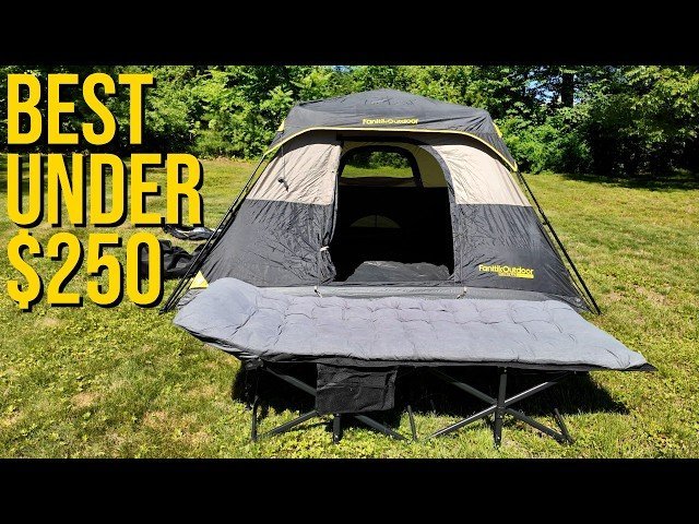 A compact camping tent set up in a sunny forest clearing with hiking gear nearby