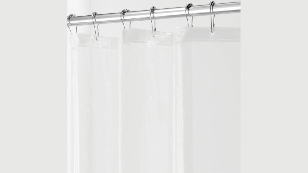 A comparison of PEVA and fabric shower curtain liners in a modern bathroom.