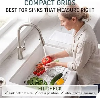 Comparison of stainless steel and silicone kitchen sink bottom grids on a counter.