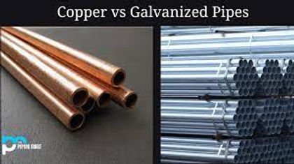 Copper pipe and galvanized steel pipe displayed together for a plumbing comparison.