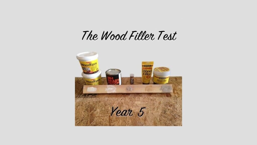 A craftsman applies epoxy wood filler to a crack in a walnut board.