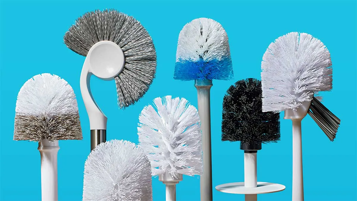 A disposable cleaning wand being prepped with a fresh pad for bathroom sanitation.