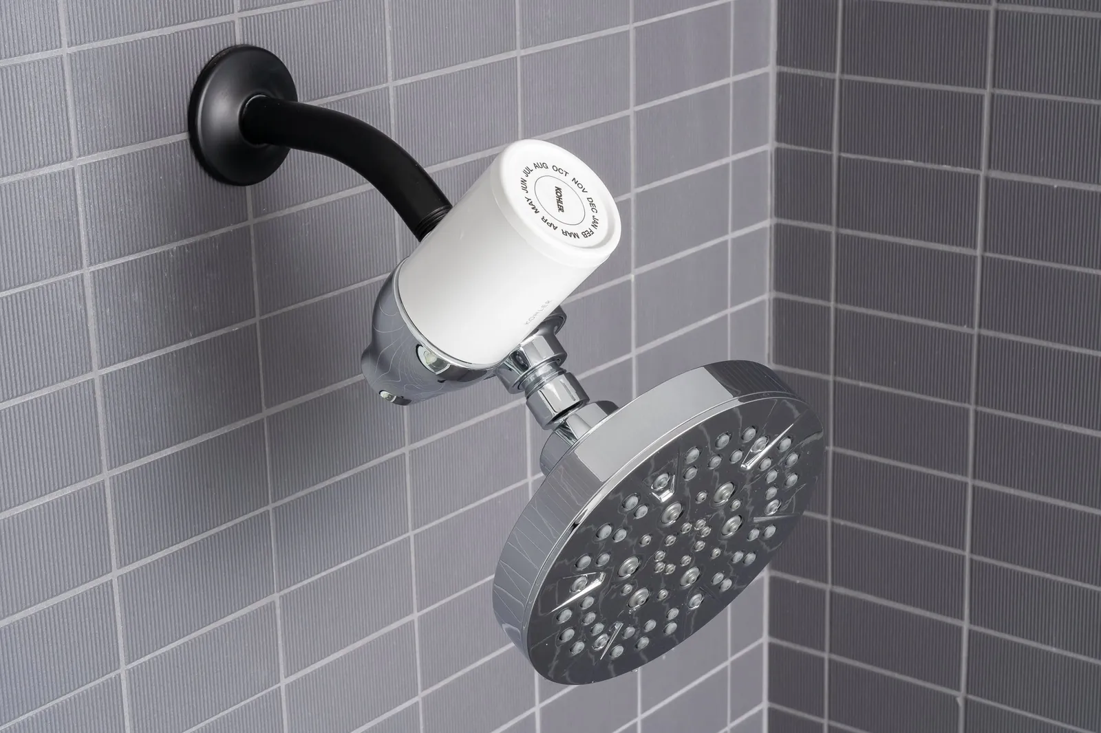 A dual-head shower system being adjusted to help decide the best shower head.