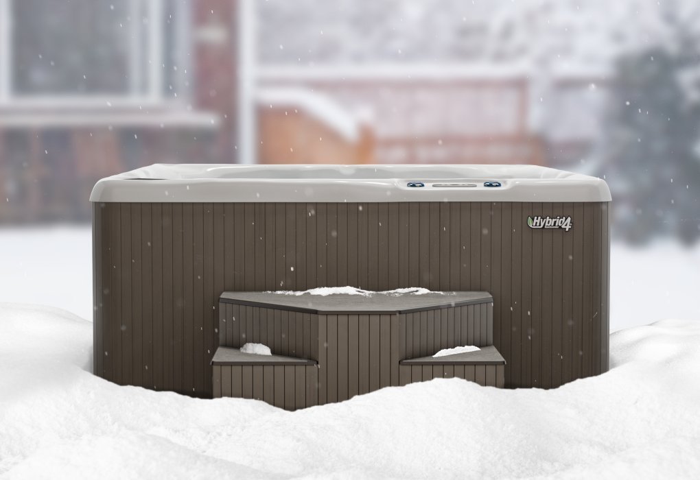 Empty hot tub covered in snow ready for winter maintenance