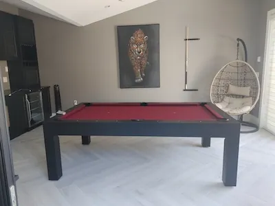 Foosball table with limited space behind it causing potential collisions