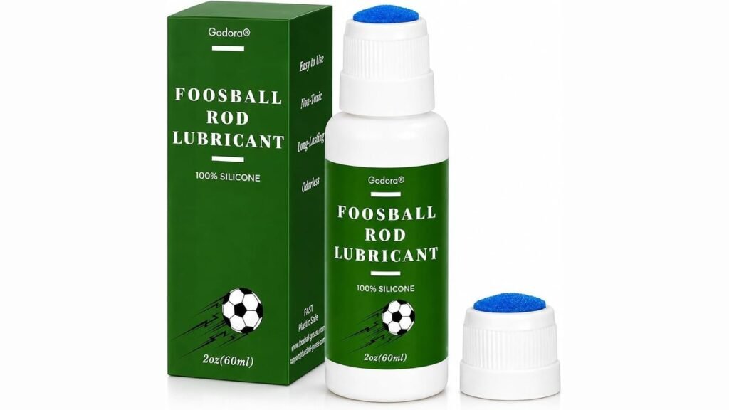 Foosball table lubricant spray and cloth on green felt