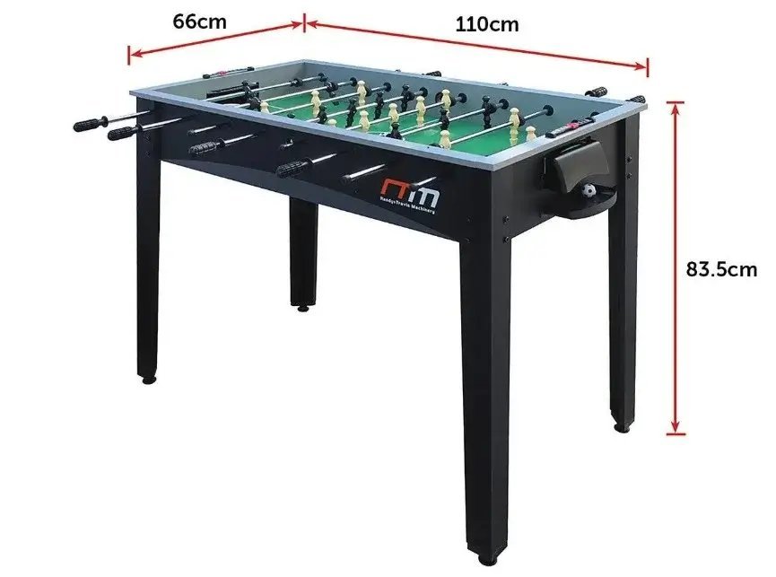 Foosball table placed in a spacious room with clear walking area