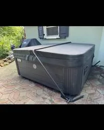 Hairline crack on the acrylic shell of a leaking hot tub