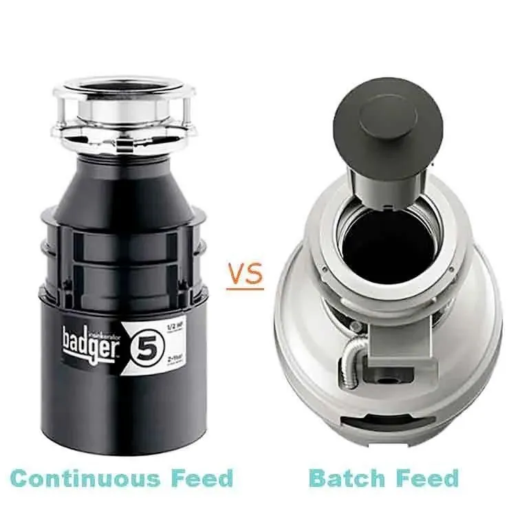 A hand locking a batch feed garbage disposal stopper into the sink drain.