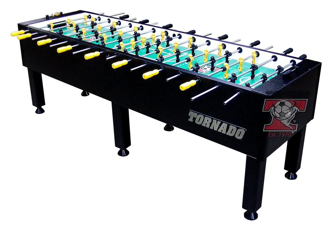 Hand wiping the playing surface of a foosball table with a microfiber cloth