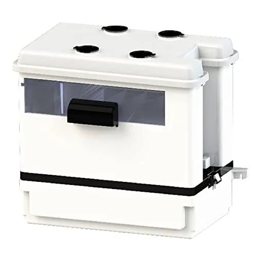 A high-lift condensate pump installed in a basement with tubing running upward.