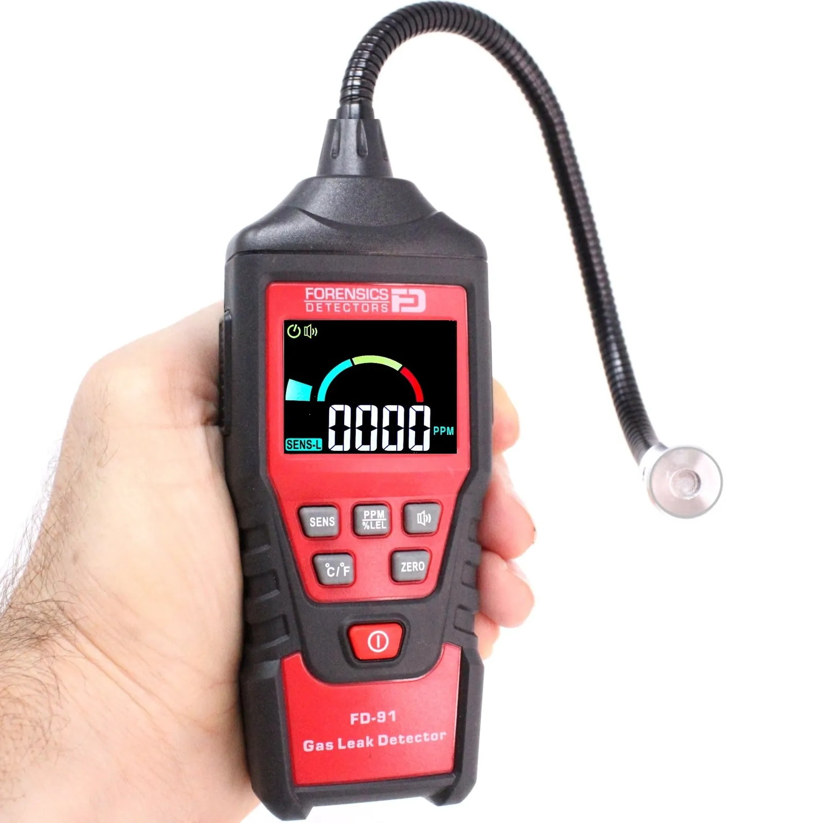 A homeowner performing maintenance on a wall-mounted gas leak detector unit.