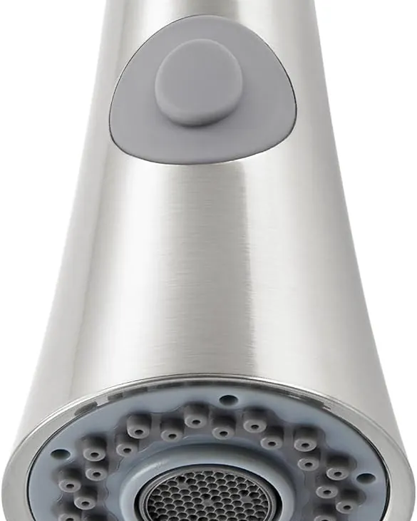 Inspecting the threaded connection of a kitchen faucet pull down spray head.