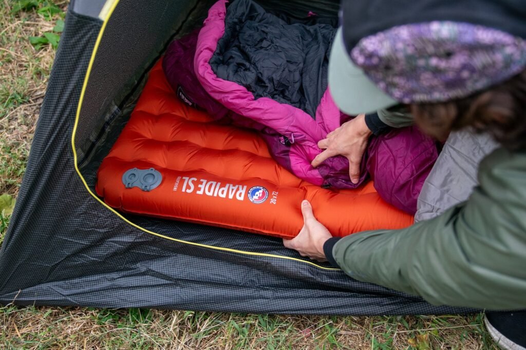 large sleeping bag in modern tent with mountain view