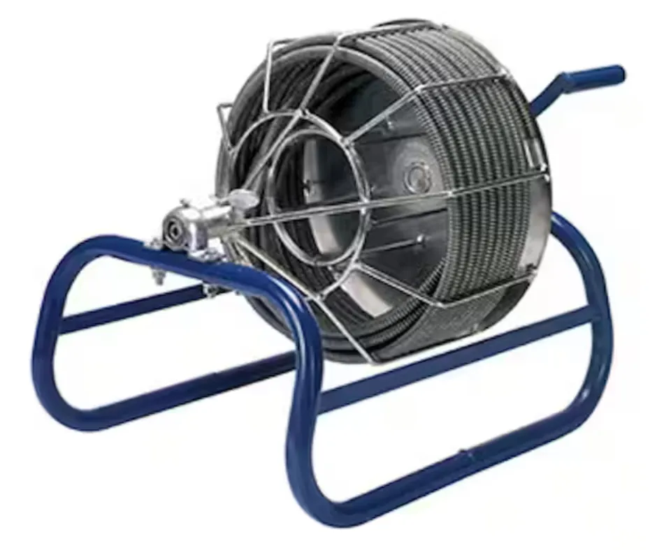 A long metal drain snake cable coiled on a bathroom floor for plumbing.
