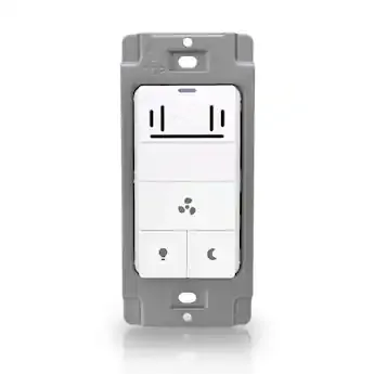 Manual timer switch for a bathroom exhaust fan installed on a wall.