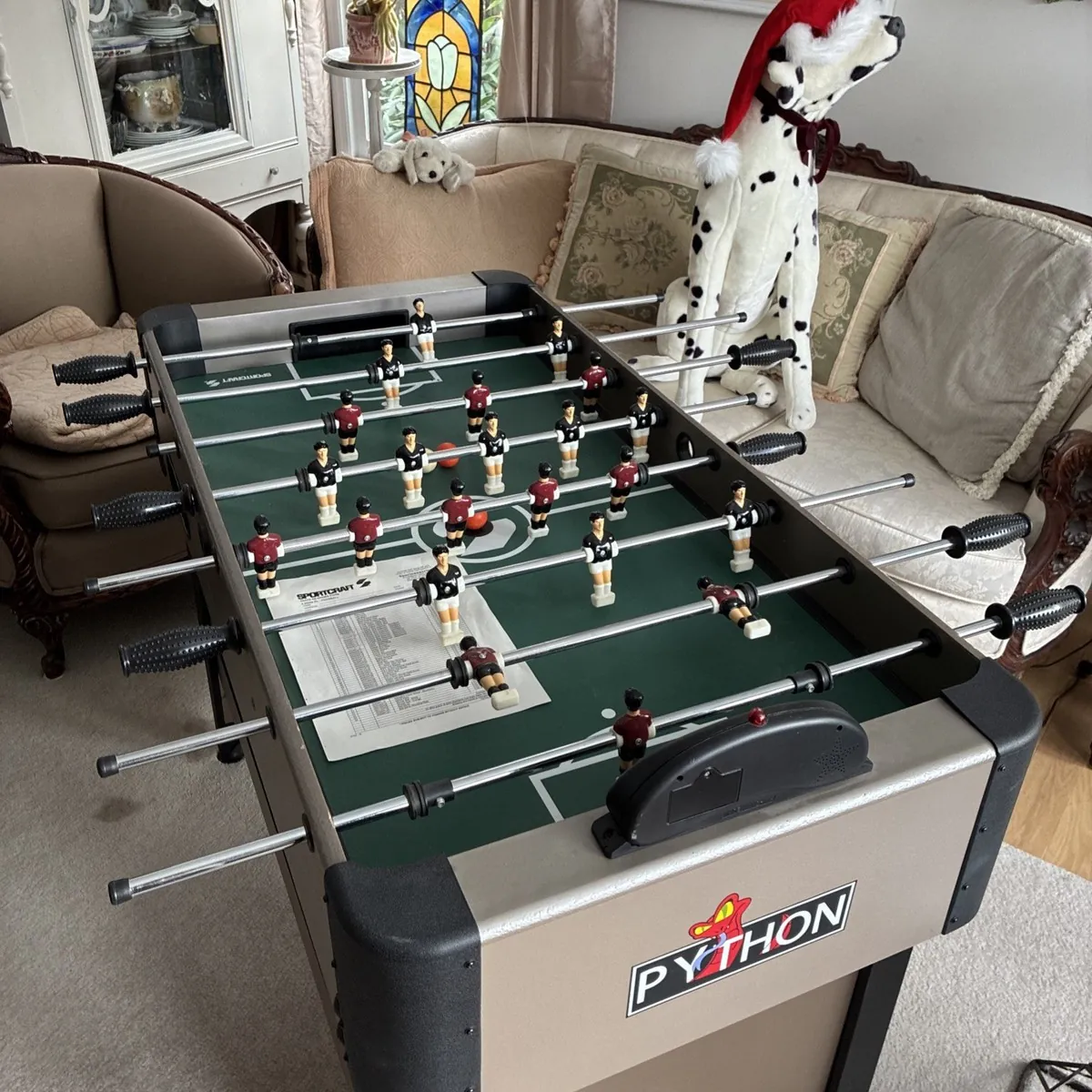 Mini foosball table on a coffee table illustrating portable options for small spaces