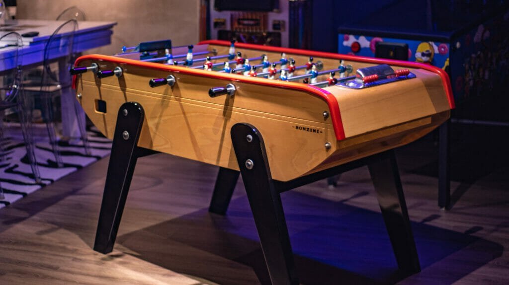 Modern foosball table in a bright minimalist living room