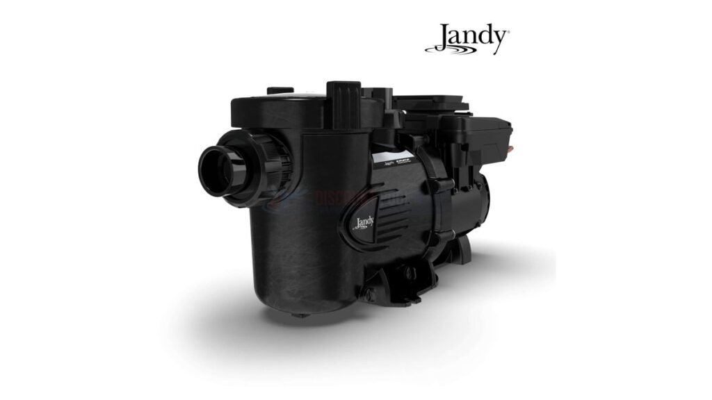 Modern Jandy pool pump next to a sparkling residential swimming pool.