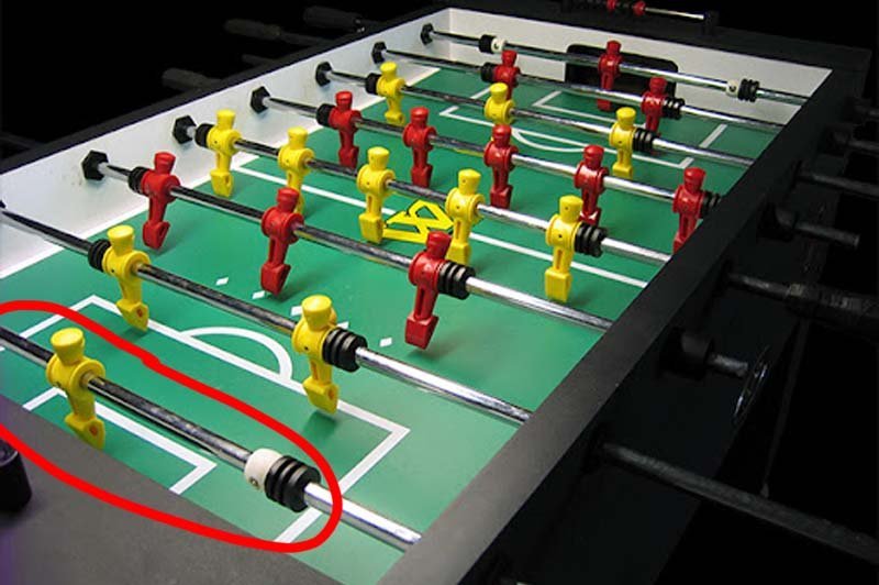 Modern one goalie foosball table in a bright living room