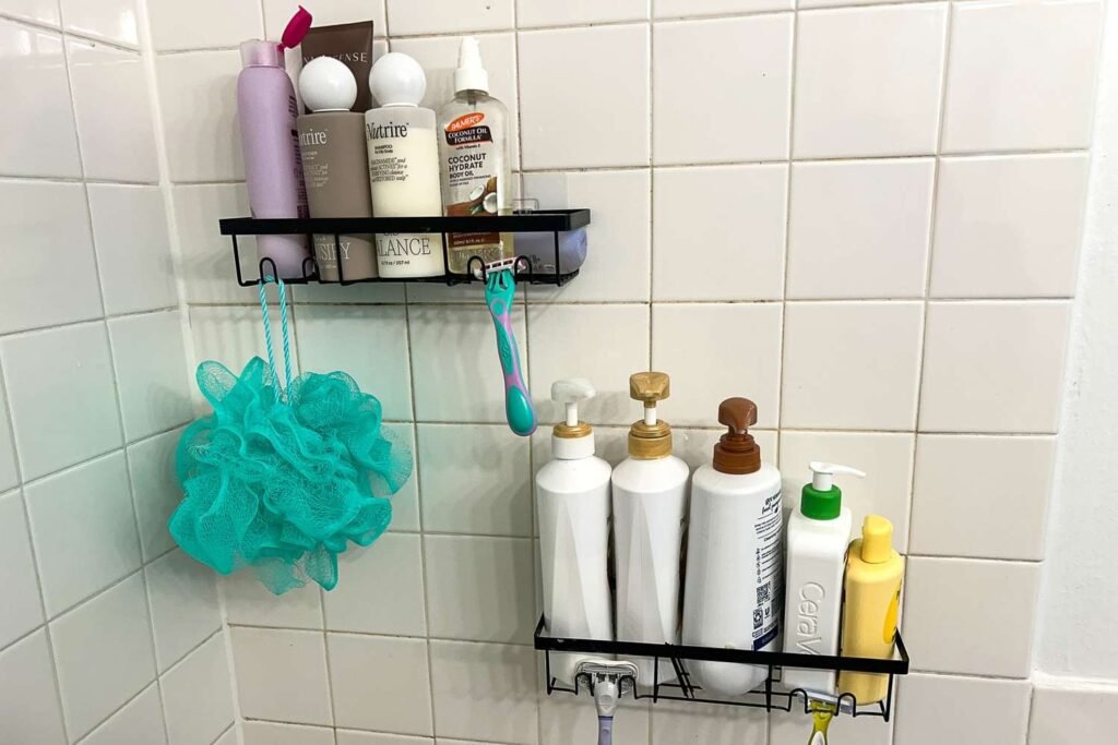 A modern shower interior showcasing various types of organized shower caddies.